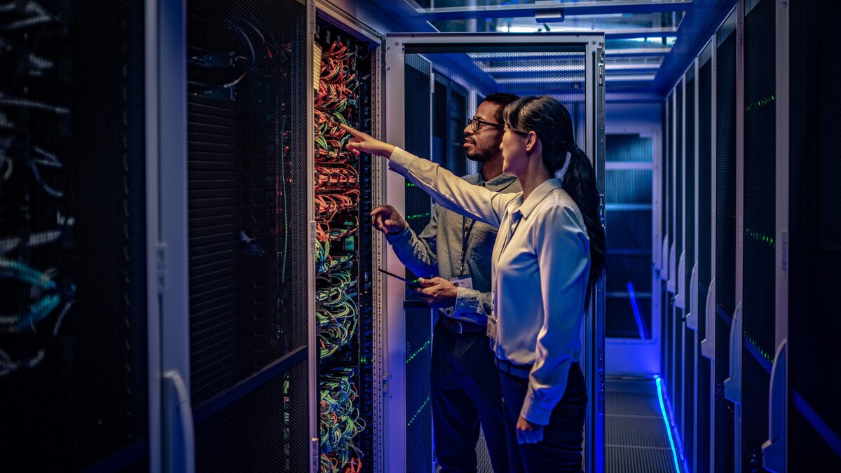 IT engineers checking servers in server room or data center